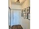 Front door entryway with wood-look flooring and decorative wall art at 600 N Carriage Hill Dr # 1082, Las Vegas, NV 89138