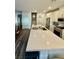 Spacious kitchen boasts stainless steel appliances, white cabinetry, and a large island at 600 N Carriage Hill Dr # 1082, Las Vegas, NV 89138