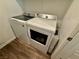 Washer and dryer in a laundry room with wood-look flooring at 600 N Carriage Hill Dr # 1082, Las Vegas, NV 89138