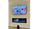 Close up view of a sleek fireplace below a large flatscreen TV creating a modern entertainment focal point at 600 N Carriage Hill Dr # 1082, Las Vegas, NV 89138