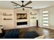 Bright living room features a modern fireplace with a mounted TV and decorative shelving at 600 N Carriage Hill Dr # 1082, Las Vegas, NV 89138