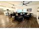 Open-concept living room and kitchen with hardwood floors, modern lighting, and stainless steel appliances at 600 N Carriage Hill Dr # 1082, Las Vegas, NV 89138
