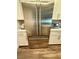 Modern stainless steel refrigerator with white cabinets in a well-lit kitchen at 600 N Carriage Hill Dr # 1082, Las Vegas, NV 89138