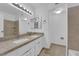 Bright bathroom with a double sink vanity and neutral-toned tile, providing ample counter space at 6299 W Washington Ave, Las Vegas, NV 89107