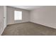 Another spacious bedroom with a large window, providing plenty of natural light and comfortable carpeting at 6299 W Washington Ave, Las Vegas, NV 89107