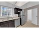 Efficient kitchen design featuring stainless steel appliances and practical layout at 6299 W Washington Ave, Las Vegas, NV 89107
