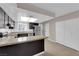 Updated kitchen featuring granite countertops, stainless steel appliances, and ample cabinet space at 6299 W Washington Ave, Las Vegas, NV 89107
