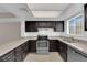 Modern kitchen with granite counters, stainless steel appliances, and efficient layout at 6299 W Washington Ave, Las Vegas, NV 89107
