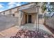 Private outdoor patio featuring a covered area and beautiful flowering trees at 6299 W Washington Ave, Las Vegas, NV 89107