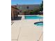 Community pool and spa area featuring clear blue water and concrete surround at 6299 W Washington Ave, Las Vegas, NV 89107