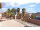 Outdoor balcony with decorative railing, palm tree view and space for entertaining at 7098 Seabirds Pl, North Las Vegas, NV 89084