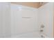 Clean bathroom shower/tub combo with bright white tile surround and chrome fixtures at 7098 Seabirds Pl, North Las Vegas, NV 89084