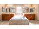 This primary bath features dual sinks and a soaking tub between the vanities at 7098 Seabirds Pl, North Las Vegas, NV 89084