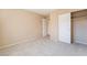 Inviting bedroom with neutral colors, plush carpet, and a closet featuring sliding doors at 7098 Seabirds Pl, North Las Vegas, NV 89084