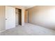 Bedroom featuring neutral walls, plush carpeting, and a closet with white sliding doors at 7098 Seabirds Pl, North Las Vegas, NV 89084