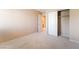 This bedroom features plush carpet, a sliding door closet, and neutral paint at 7098 Seabirds Pl, North Las Vegas, NV 89084