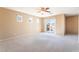 Bonus room featuring neutral carpet, paint, natural light and balcony access at 7098 Seabirds Pl, North Las Vegas, NV 89084