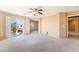 Bonus room featuring plush neutral carpet, balcony access, and tons of natural light at 7098 Seabirds Pl, North Las Vegas, NV 89084