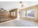 Bonus room with tile flooring, large windows, and a glass door leading to the outdoors at 7098 Seabirds Pl, North Las Vegas, NV 89084