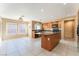 Spacious kitchen features a central island, granite countertops, and stainless steel appliances at 7098 Seabirds Pl, North Las Vegas, NV 89084