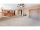 Cozy living room with a fireplace and an open view of the modern kitchen at 7098 Seabirds Pl, North Las Vegas, NV 89084