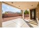 Covered patio area with concrete flooring and view of a spacious backyard at 7098 Seabirds Pl, North Las Vegas, NV 89084