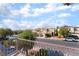 Street view from the home's balcony of a tree-lined street and well-kept homes at 7098 Seabirds Pl, North Las Vegas, NV 89084