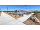 Community basketball court and playground area with benches, walking paths, and mountain views at 7384 Hayes Harbor Ct # Lot 213, North Las Vegas, NV 89084