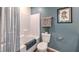 Bathroom featuring a bathtub with a shower, toilet, and blue accent wall at 7384 Hayes Harbor Ct # Lot 213, North Las Vegas, NV 89084