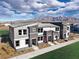 Contemporary townhome featuring modern architectural design, landscaping, and excellent curb appeal at 7384 Hayes Harbor Ct # Lot 213, North Las Vegas, NV 89084