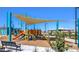 Community playground area with shade structures, walking paths, and benches at 7384 Hayes Harbor Ct # Lot 213, North Las Vegas, NV 89084