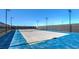 Community tennis court, fenced, featuring lighting for nighttime use at 7384 Hayes Harbor Ct # Lot 213, North Las Vegas, NV 89084