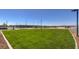 Manicured community turf area, fenced, featuring walking path and seating at 7384 Hayes Harbor Ct # Lot 213, North Las Vegas, NV 89084