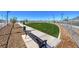 Community turf area, fenced, with seating and walking path at 7384 Hayes Harbor Ct # Lot 213, North Las Vegas, NV 89084
