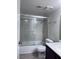 Bathroom features a single sink vanity and a shower-tub combo with sliding glass doors at 805 Rock Springs Dr # 101, Las Vegas, NV 89128