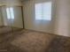 Bedroom features a large closet and a window allowing natural light to brighten the space at 805 Rock Springs Dr # 101, Las Vegas, NV 89128