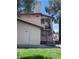 Two-story condo featuring a covered stairwell leading to the entrance at 805 Rock Springs Dr # 101, Las Vegas, NV 89128