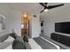 Bedroom featuring ensuite bathroom, a TV and ample closet space and modern ceiling fan at 8070 W Russell Rd # 2026, Las Vegas, NV 89113
