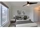 Cozy bedroom with natural light, featuring a comfortable bed and stylish bedside tables and lamps at 8070 W Russell Rd # 2026, Las Vegas, NV 89113
