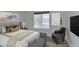 Bedroom featuring seating, a large window and ample closet space and decorative wall mirror at 8070 W Russell Rd # 2026, Las Vegas, NV 89113