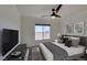 Serene bedroom with neutral tones, a large window, and a comfortable bed with decorative pillows at 8070 W Russell Rd # 2026, Las Vegas, NV 89113