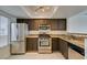 Well-equipped kitchen featuring stainless steel appliances and granite countertops at 8070 W Russell Rd # 2026, Las Vegas, NV 89113