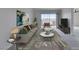 Modern living room featuring stylish decor and an open layout with balcony access at 8070 W Russell Rd # 2026, Las Vegas, NV 89113