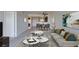 Bright living room featuring modern furniture, stylish decor, and an open layout to the dining area at 8070 W Russell Rd # 2026, Las Vegas, NV 89113