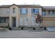 Inviting townhome featuring a neutral color palette, tidy landscaping, and a two-car garage at 8139 Retriever Ave, Las Vegas, NV 89147