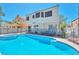 Spacious backyard with a refreshing pool and comfortable seating area at 8404 Shore Breeze Dr, Las Vegas, NV 89128