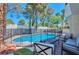 Secluded backyard oasis with a refreshing pool, patio, and desert landscaping at 8404 Shore Breeze Dr, Las Vegas, NV 89128