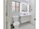 Modern bathroom with a floating vanity, LED mirror, and stylish fixtures at 8404 Shore Breeze Dr, Las Vegas, NV 89128