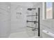 Modern bathroom with sleek black hardware, glass door, and white patterned wall at 8404 Shore Breeze Dr, Las Vegas, NV 89128