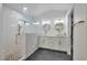 Modern bathroom with stylish finishes, dual sinks, and a glass-enclosed shower at 8404 Shore Breeze Dr, Las Vegas, NV 89128